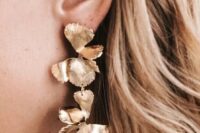 bold statement gold floral earrings are amazing for a wedding, they will add a delicate and refined feel to your look