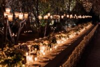 candleholders on the table and candles over the table plus additional chandeliers made of them are amazing for a destination wedding