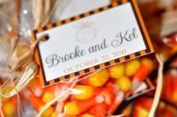 candy corns in packs with tags is a very simple and very fall-inspired idea, everyone will enjoy them a lot