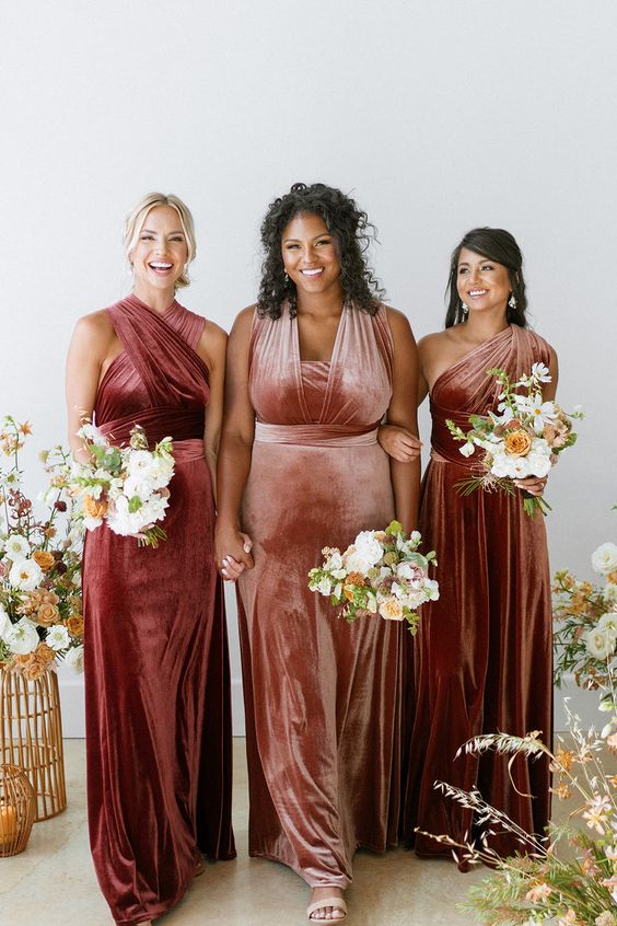 chic red and dusty pink mismatching velvet maxi bridesmaid dresses with variously draped bodice are a lovely idea