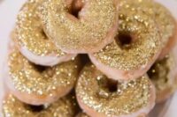 donuts topped with edible gold glitter is a great dessert idea, donuts are trendier than cakes now