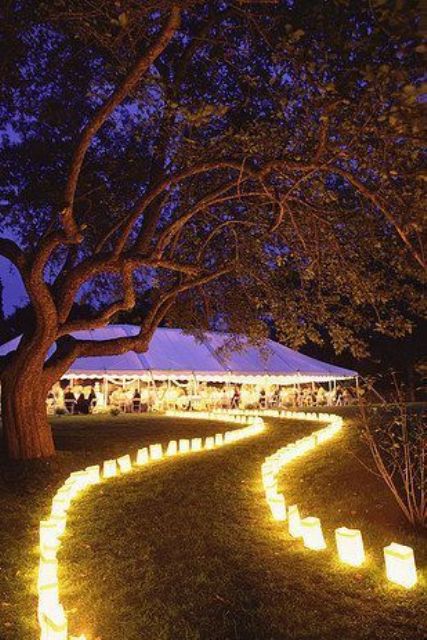 lots of candle lanterns lining up your way to the reception look really magical at night and add interest to your decor