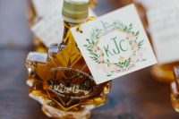 maple syrup in maple leaf-shaped bottles and with tags is a classic fall wedding favor idea and will make everyone happy