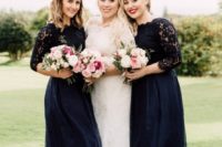 midnight blue high low bridesmaid dresses with lace bodices and long sleeves plus navy shoes