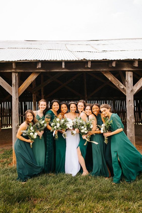 mismatching green maxi bridesmaid dresses of two diffeernt colors and with various designs for a fall wedding