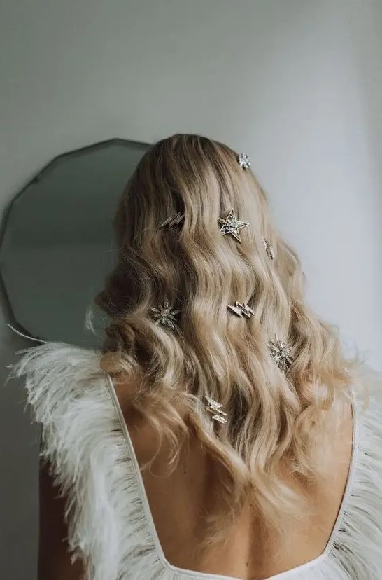 oversized star and thunderbolt rhinestone hair clips are amazing on messy long hair or on long waves like here