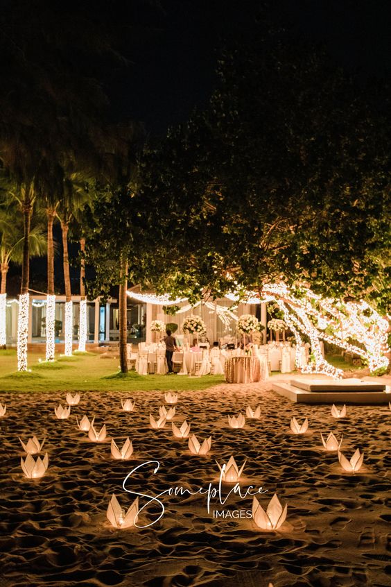 paper lotus lamps and string lights are great for a beach wedding, they are chic and very romantic