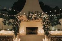 pillar candles in glasses all over the wedding ceremony space are amazing to create a welcoming and very romantic ambience