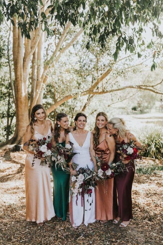 pretty mismatching slip maxi bridesmaid dresses in rust, deep purple, neutral, emerald are a trendy idea to rock