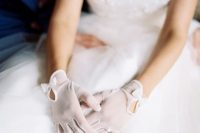 pretty sheer bridal gloves with cutouts and bows are amazing to spruce up your look and give it a bit of retro elegance