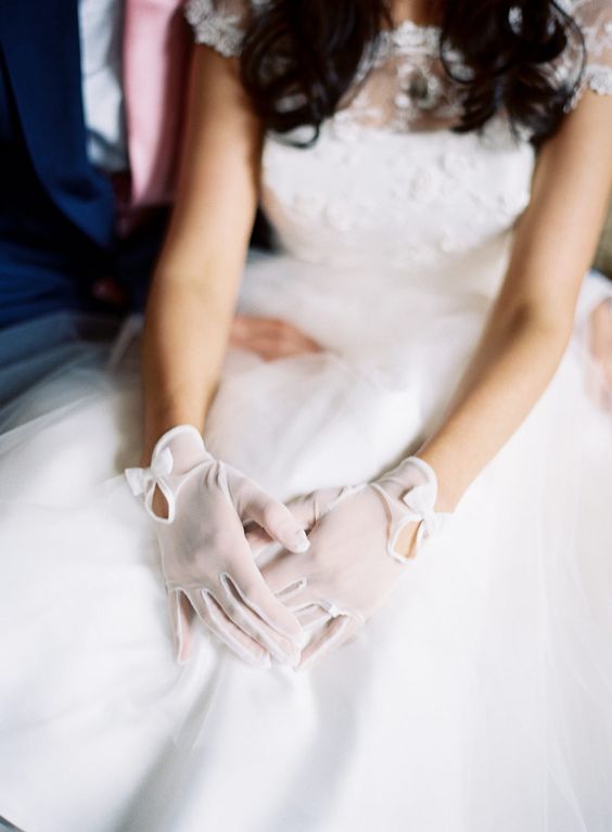 pretty sheer bridal gloves with cutouts and bows are amazing to spruce up your look and give it a bit of retro elegance
