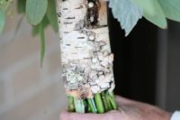 a birch bark wrap with pearl pins is a very cute rustic idea that looks chic