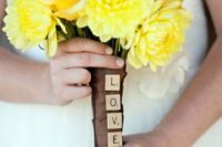 a brown bouquet wrap with scrabble LOVE letters is a very cute and whimsy idea