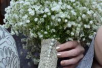 a burlap bouquet wrap with pearl pins is a very chic and traditionally rustic idea