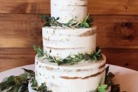 a chic naked wedding cake with gold leaf and greenery is a cool piece for many weddings, not only a rustic one