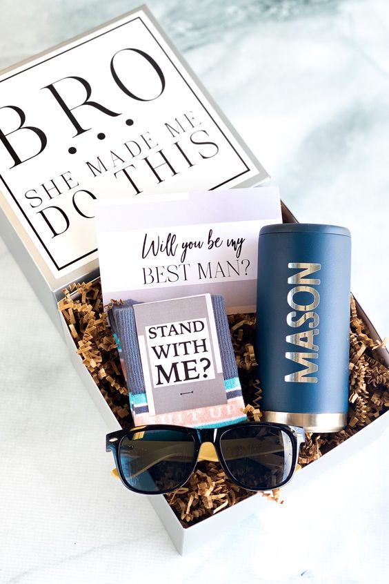 a cool box with a card, a notebook, a personalized beer can, sunglasses is a fun idea