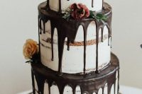 a fantastic three-tier naked wedding cake with chocolate drip, blooms, greenery is a gorgeous idea for many weddings