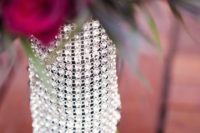 a fully embellished bouquet wrap is a very glam and chic idea for a modern bride