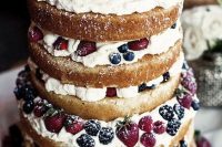 a jaw-dropping naked wedding cake with frosting and fresh berries is a fantastic idea for a summer wedding