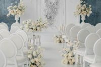 a luxurious wedding backdrop done with appliques and beads plus white or neutral bloom arrangements
