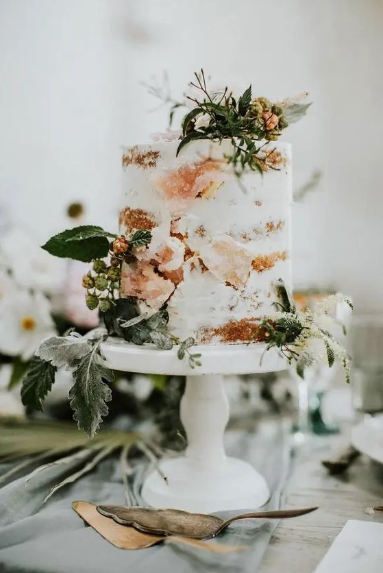a naked cake with fresh herbs, berries and sugar geodes that are a cool wedding trend