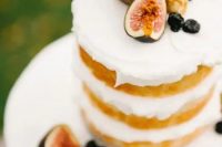 a naked wedding cake topped with fresh fruit and berries is a lovely idea for a fall wedding, whether it’s a vineyard one or not