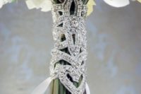 a super glam fully embeslliehd bouquet wrap with white ribbons is amaazing for an art deco or glam bouquet