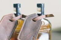 alcohol bottles with personalized leather tags are amazing as groomsmen gifts, and these tags can be used for luggager after