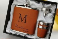 an elegant groomsmen gift set with a leather covered flask, metal shots in leather covers is very elegant