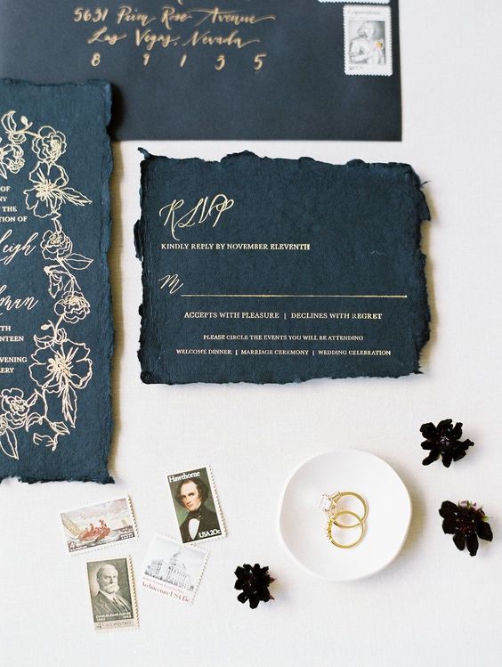 black wedding invites with a raw hem and gold calligraphy are perfect for a gothic wedding