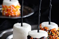 marshmallow pops with chocolate and colorful confetti are a delicious idea and they can be made easily