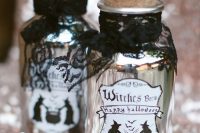 mini alcohol bottles styled as witches’ brew with black lace are very cool and stylish