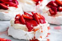 mini cheesecake pavlovas with fresh strawberries are delicious for a spring or summer wedding