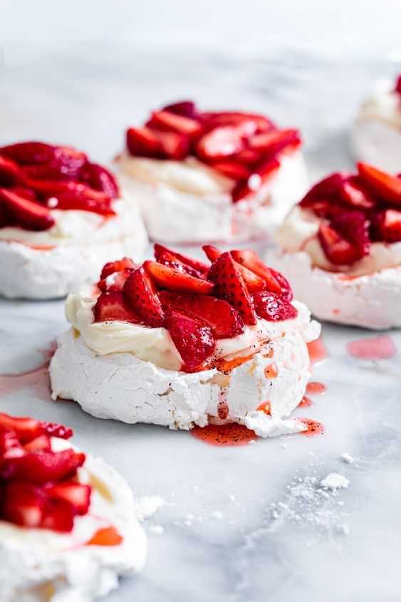 mini cheesecake pavlovas with fresh strawberries are delicious for a spring or summer wedding