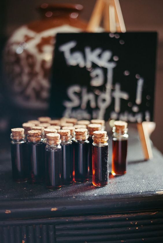 mini test tubes with brandy look as test tubes with blood and are adorable for a Halloween wedding