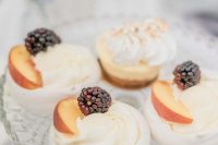 pavlovas topped with fresh peaches and blackberries are delicious and very refined wedding desserts to serve