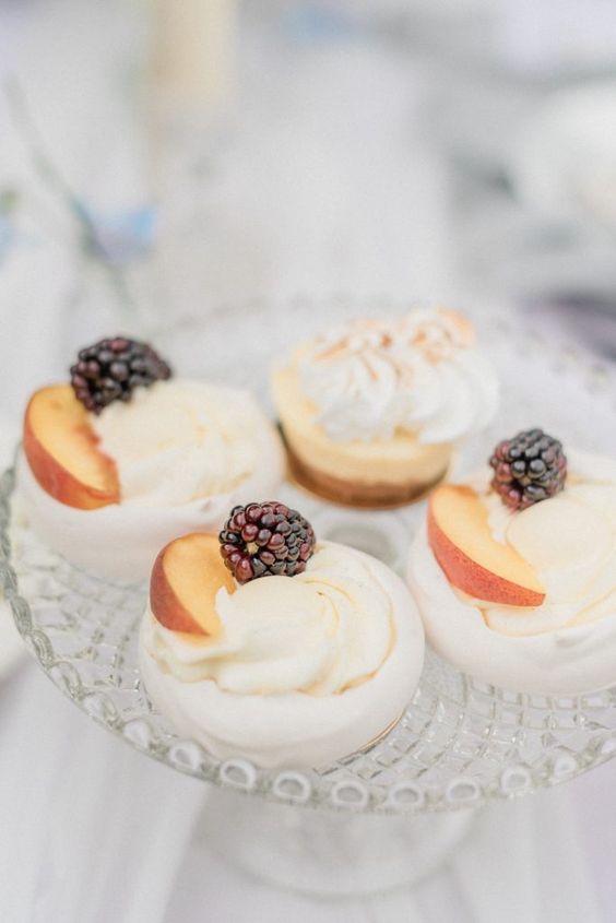 pavlovas topped with fresh peaches and blackberries are delicious and very refined wedding desserts to serve