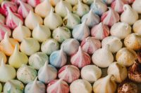 rainbow-colored mini meringue kisses are amazing to serve at your wedding, especiall if it’s a colorful one