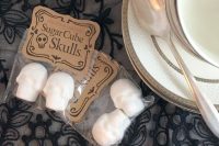 sugar cube skulls packed individually are cool and very budget-friendly Halloween wedding favors to rock
