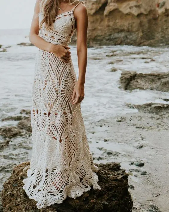 a boho beach A line wedding dress with spaghetti straps and various patterns is a lovely idea for a laid back beach bride