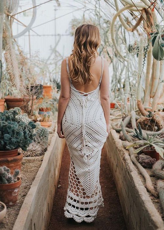 a boho crochet wedding dress with a mermaid silhouette, spaghetti straps, an open back is ideal for a boho desert wedding and will keep you cool