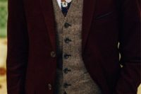 a burgundy velvet suit, a brown tweed waistcoat, a white button down, a moody floral tie for a winter look with a touch of boho