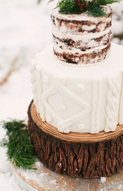 a cool wedding cake with a cable knit tier and a naked one topped with fresh greenery is a lovely winter decor idea