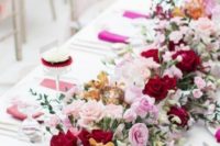 a heavenly bright floral garland in pink, burgundy and marigold plus white is a chic idea