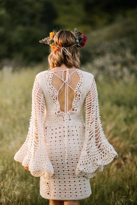 a knee crochet wedding dress with a lace up back, bell sleeves is a lovely idea for a summer boho bride