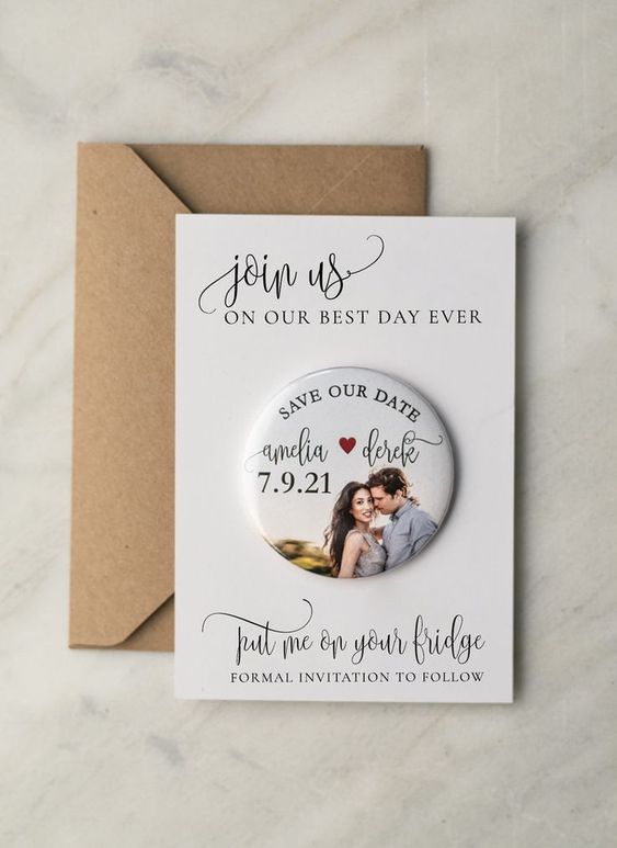 a lovely modern save the date with a paper and a magnet part, with the couple's photo and calligraphy is amazing