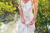 a lovely spaghetti strap crochet maxi wedding dress and a statement bracelet for a chic boho look