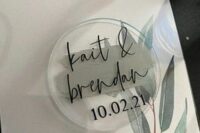 a neutral botanical save the date with botanical prints and black letters, a clear acrylic save the date magnet is amazing