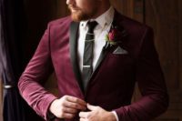 a plum-colored velvet tux, a white button down, a black suit, black pants and some chains for an accent