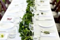 a simple greenery table garland will refresh your neutral tablescape, even if you have an all-white wedding